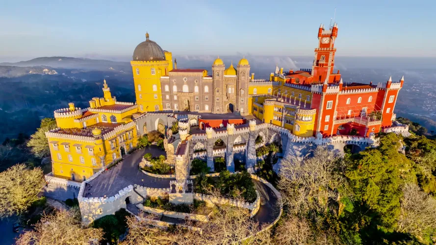 Palácio da Pena perched on a hilltop in Sintra, Portugal — best visited midweek to avoid the crowds